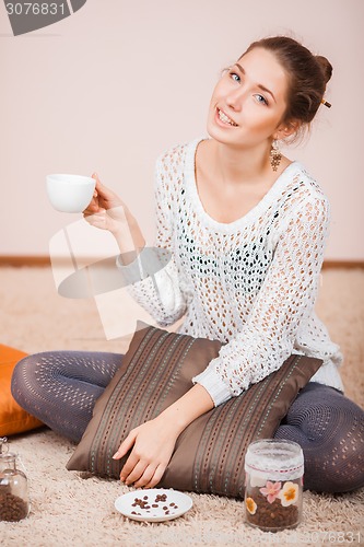 Image of Smiling Woman with cup of coffee