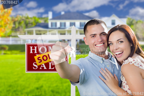 Image of Military Couple In Front of Home, House Keys and Sign