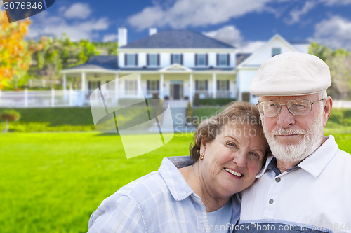 Image of Happy Senior Couple in Front of House