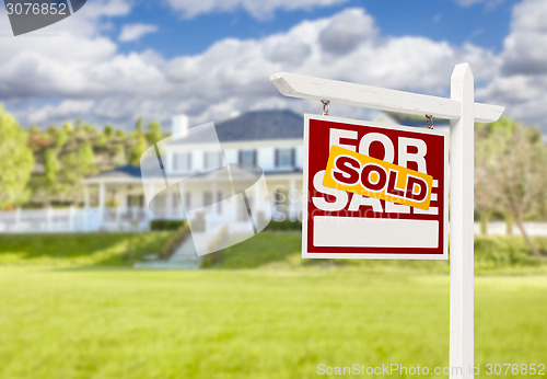 Image of Sold Home For Sale Sign in Front of New House