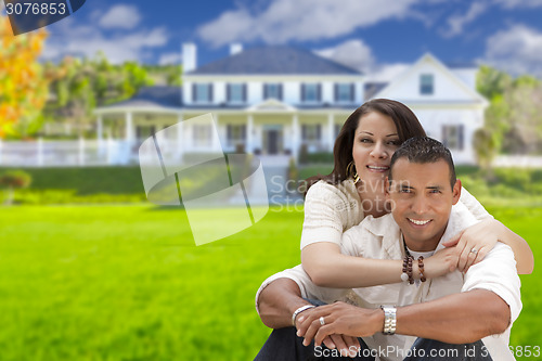 Image of Happy Hispanic Young Couple in Front of Their New Home