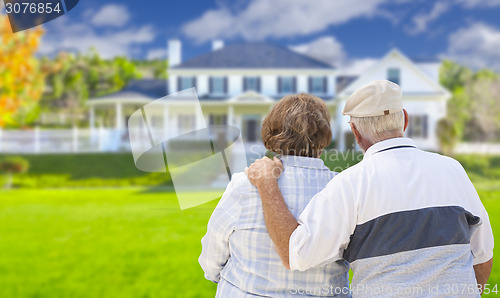 Image of Happy Senior Couple Looking at Front of House