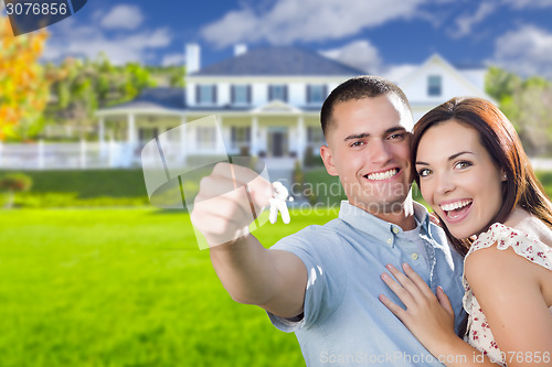 Image of Military Couple with House Keys In Front of New Home