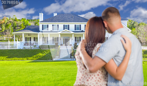 Image of Military Couple Looking at Nice New House