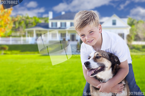 Image of Young Boy and His Dog in Front of House