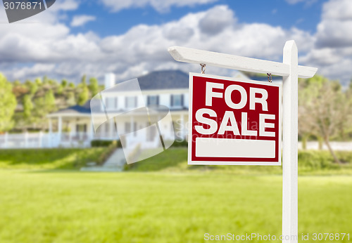 Image of Home For Sale Sign in Front of New House