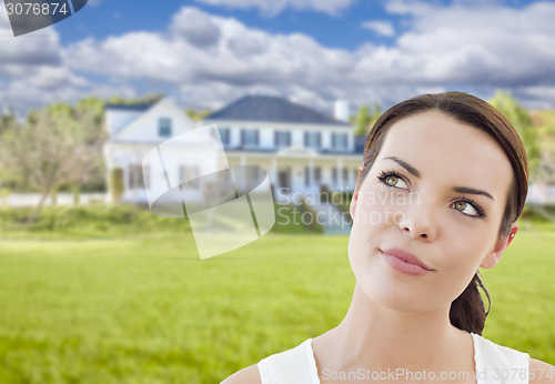 Image of Thoughtful Mixed Race Woman In Front of House