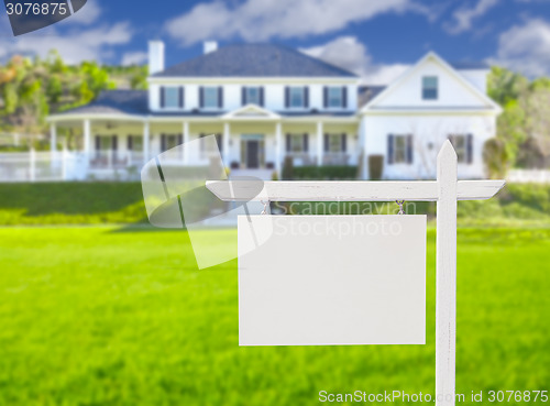 Image of Blank Real Estate Sign in Front of New House 