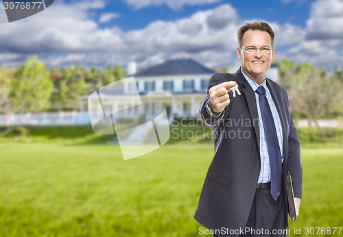 Image of Real Estate Agent with House Keys in Front of Home