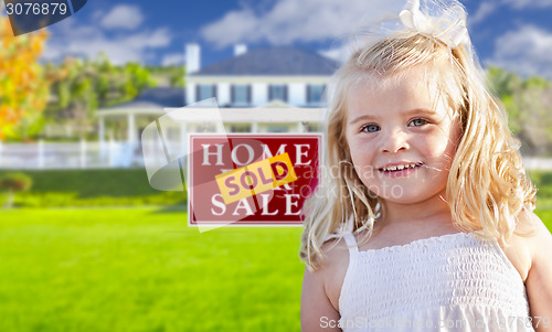 Image of Girl in Yard with Sold Real Estate Sign and House