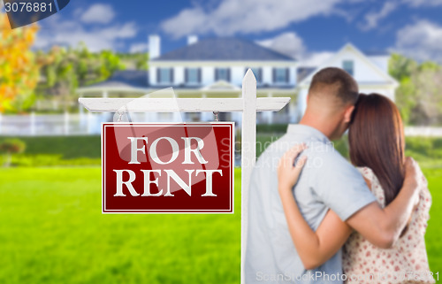 Image of For Rent Real Estate Sign, Military Couple Looking at House