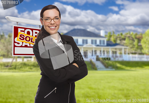 Image of Mixed Race Woman in Front of House and Sold Sign