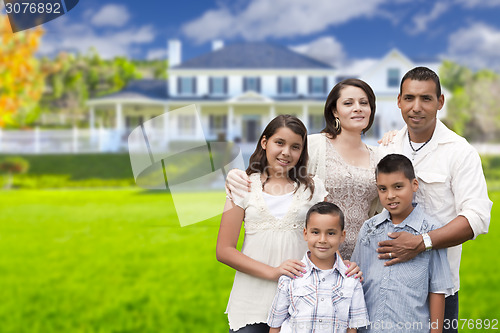 Image of Young Hispanic Family in Front of Their New Home