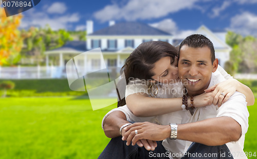 Image of Happy Hispanic Young Couple in Front of Their New Home