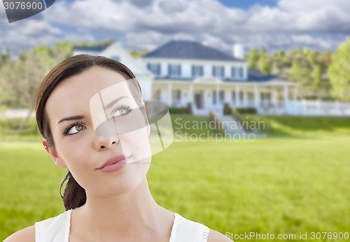 Image of Thoughtful Mixed Race Woman In Front of House