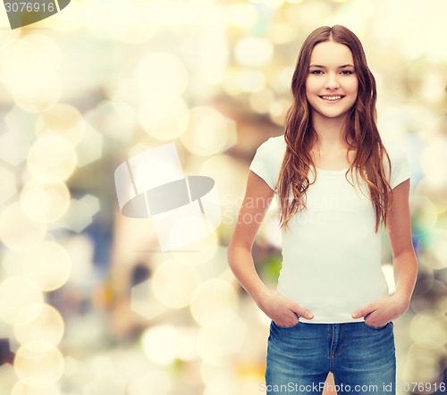 Image of smiling teenager in blank white t-shirt