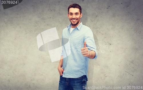 Image of smiling man showing thumbs up