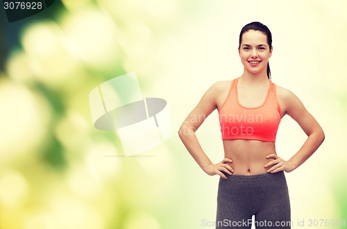 Image of smiling teenage girl in sportswear