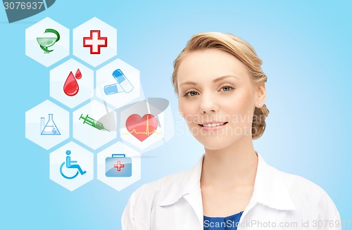 Image of smiling doctor over medical icons blue background