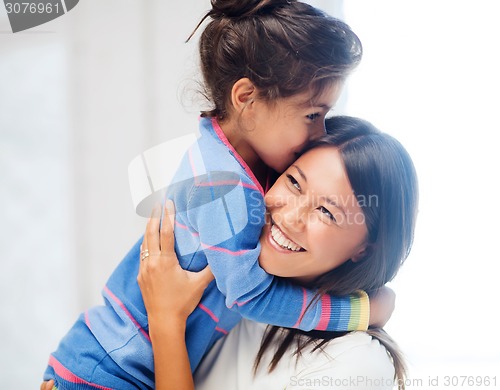 Image of hugging mother and daughter