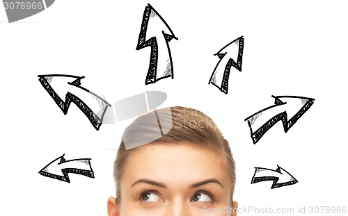 Image of close up of woman looking to arrow doodles