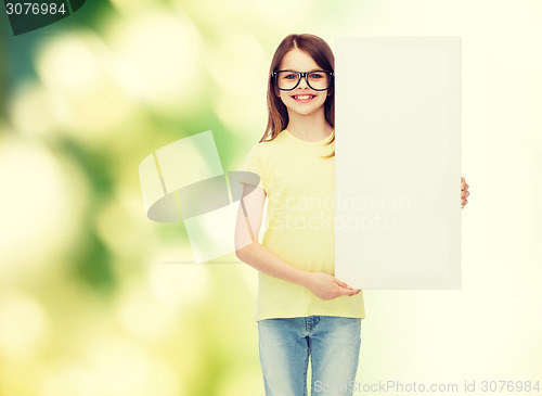 Image of little girl wearing eyeglasses with blank board