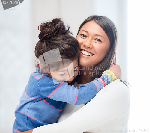 Image of hugging mother and daughter