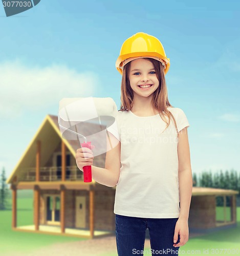 Image of smiling little girl in helmet with paint roller