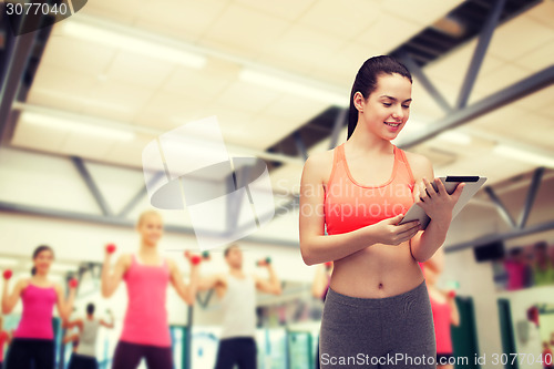 Image of sporty woman with tablet pc computer