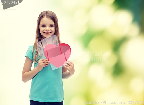 Image of smiling little girl with red heart