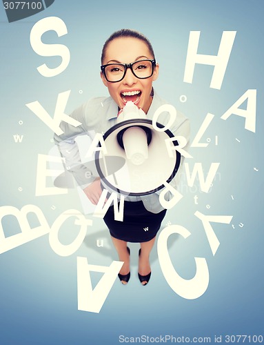 Image of screaming businesswoman with megaphone