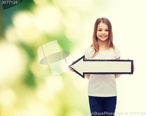 Image of smiling girl with blank arrow pointing left