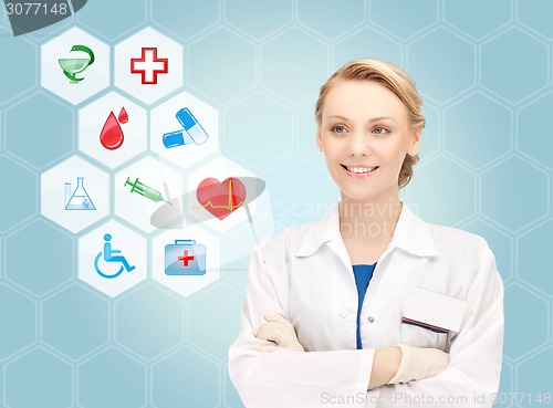 Image of smiling doctor over medical icons blue background