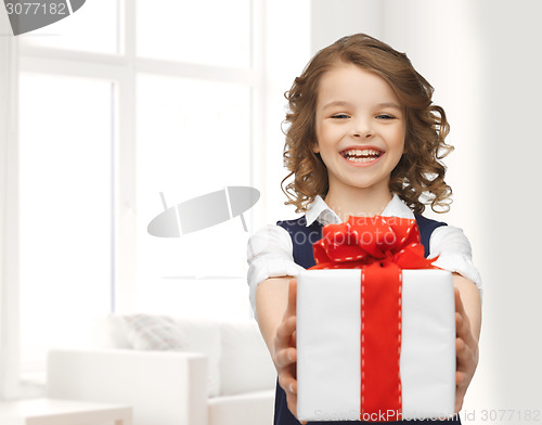 Image of happy smiling girl with gift box