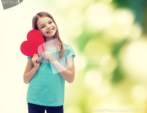 Image of smiling little girl with red heart