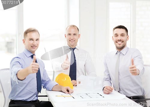 Image of happy team of architects and designers in office