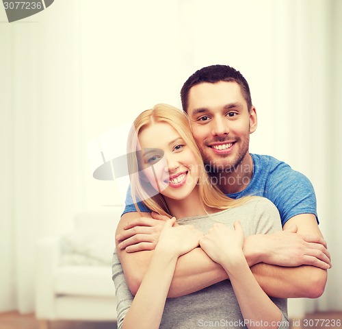 Image of smiling couple hugging