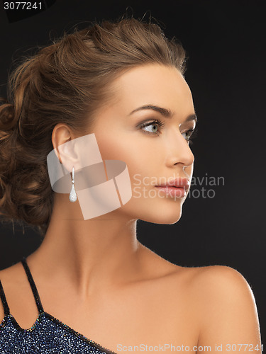 Image of woman with diamond earrings