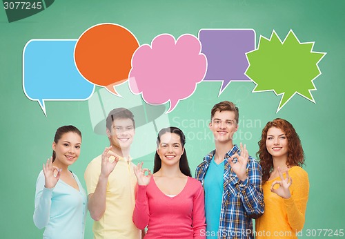 Image of group of smiling teenagers with text bubble