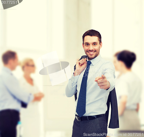 Image of handsome buisnessman with jacket over shoulder