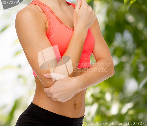 Image of sporty woman with pain in elbow