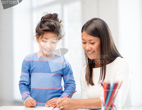 Image of mother and daughter drawing