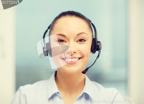 Image of female helpline operator with headphones