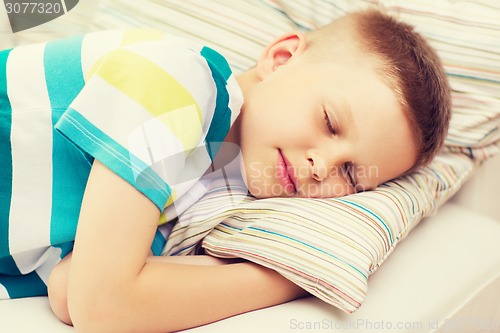 Image of little boy sleeping at home