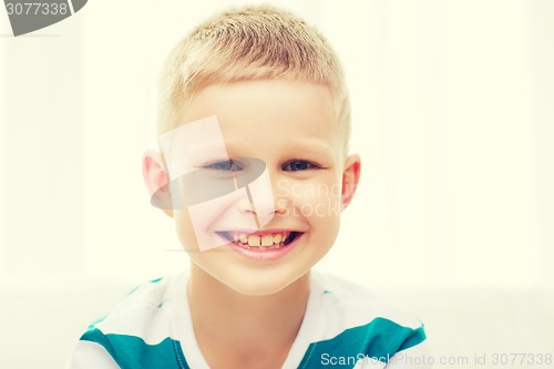 Image of smiling little student boy at home