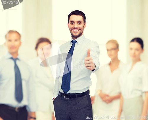 Image of handsome businessman with crossed arms