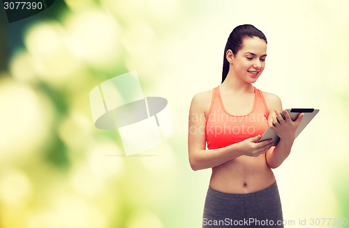 Image of sporty woman with tablet pc computer