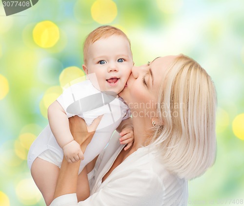 Image of happy mother with baby over green background