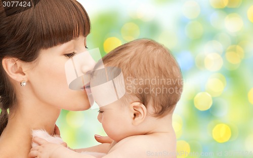 Image of happy mother with baby over green background