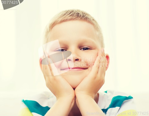 Image of smiling little student boy at home